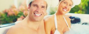 happy couple smile when relax hot tub