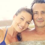 Happy time couple relax with inflatable hot tub
