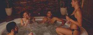 4 person soaking on hot tub