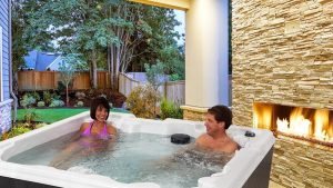 Happy couple soaking in the hot tub